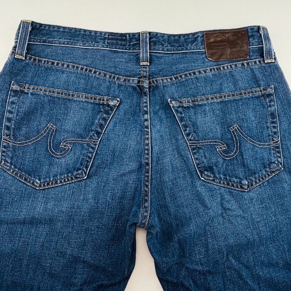 AG Adriano Goldschmied Men’s Straight Jeans - Blue with Brown Patch